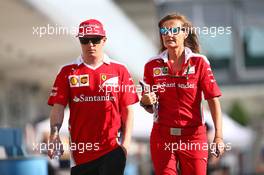 Kimi Raikkonen (FIN) Ferrari with Stefania Bocchi (ITA) Ferrari Press Officer. 06.10.2016. Formula 1 World Championship, Rd 17, Japanese Grand Prix, Suzuka, Japan, Preparation Day.