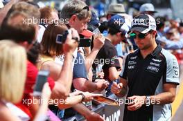 Sergio Perez (MEX) Sahara Force India F1 signs autographs for the fans. 27.05.2016. Formula 1 World Championship, Rd 6, Monaco Grand Prix, Monte Carlo, Monaco, Friday.