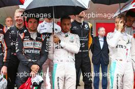 Lewis Hamilton (GBR) Mercedes AMG F1 and Sergio Perez (MEX) Sahara Force India F1 as the grid observes the national anthem. 29.05.2015. Formula 1 World Championship, Rd 6, Monaco Grand Prix, Monte Carlo, Monaco, Race Day.