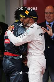 Race winner Lewis Hamilton (GBR) Mercedes AMG F1 celebrates on the podium with second placed Daniel Ricciardo (AUS) Red Bull Racing. 29.05.2015. Formula 1 World Championship, Rd 6, Monaco Grand Prix, Monte Carlo, Monaco, Race Day.