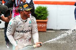 Race winner Lewis Hamilton (GBR) Mercedes AMG F1 celebrates with the champagne on the podium. 29.05.2015. Formula 1 World Championship, Rd 6, Monaco Grand Prix, Monte Carlo, Monaco, Race Day.