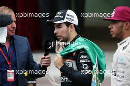 Sergio Perez (MEX) Sahara Force India F1 with Martin Brundle (GBR) Sky Sports Commentator and Lewis Hamilton (GBR) Mercedes AMG F1 at the podium. 29.05.2015. Formula 1 World Championship, Rd 6, Monaco Grand Prix, Monte Carlo, Monaco, Race Day.