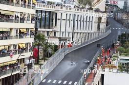 Lewis Hamilton (GBR) Mercedes AMG F1 W07 Hybrid passes team mate Nico Rosberg (GER) Mercedes AMG F1 W07 Hybrid. 29.05.2015. Formula 1 World Championship, Rd 6, Monaco Grand Prix, Monte Carlo, Monaco, Race Day.