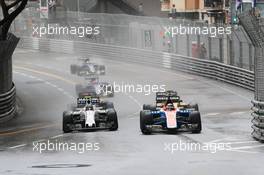 Pascal Wehrlein (GER) Manor Racing MRT05 and Valtteri Bottas (FIN) Williams FW38 battle for position. 29.05.2015. Formula 1 World Championship, Rd 6, Monaco Grand Prix, Monte Carlo, Monaco, Race Day.