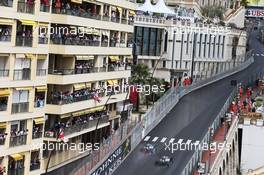 Lewis Hamilton (GBR) Mercedes AMG F1 W07 Hybrid passes team mate Nico Rosberg (GER) Mercedes AMG F1 W07 Hybrid. 29.05.2015. Formula 1 World Championship, Rd 6, Monaco Grand Prix, Monte Carlo, Monaco, Race Day.