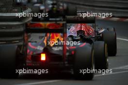 Daniil Kvyat (RUS) Scuderia Toro Rosso STR11 leads Max Verstappen (NLD) Red Bull Racing RB12. 29.05.2015. Formula 1 World Championship, Rd 6, Monaco Grand Prix, Monte Carlo, Monaco, Race Day.