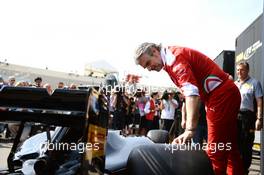 Maurizio Arrivabene (ITA) Ferrari Team Principal takes a look at a Pirell mock up of what a 2017 F1 car and tyres may look like. 28.05.2016. Formula 1 World Championship, Rd 6, Monaco Grand Prix, Monte Carlo, Monaco, Qualifying Day.