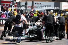 Lewis Hamilton (GBR) Mercedes AMG F1 W07 Hybrid is pushed back in the pits during qualifying. 28.05.2016. Formula 1 World Championship, Rd 6, Monaco Grand Prix, Monte Carlo, Monaco, Qualifying Day.