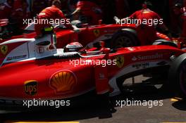 Kimi Raikkonen (FIN) Ferrari SF16-H and team mate Sebastian Vettel (GER) Ferrari SF16-H in the pits. 28.05.2016. Formula 1 World Championship, Rd 6, Monaco Grand Prix, Monte Carlo, Monaco, Qualifying Day.