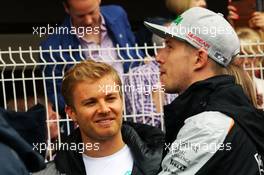 (L to R): Nico Rosberg (GER) Mercedes AMG F1 with Nico Hulkenberg (GER) Sahara Force India F1 on the drivers parade. 29.05.2015. Formula 1 World Championship, Rd 6, Monaco Grand Prix, Monte Carlo, Monaco, Race Day.