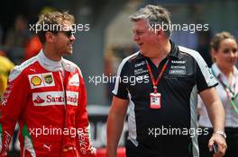 (L to R): Sebastian Vettel (GER) Ferrari with Otmar Szafnauer (USA) Sahara Force India F1 Chief Operating Officer. 26.05.2016. Formula 1 World Championship, Rd 6, Monaco Grand Prix, Monte Carlo, Monaco, Practice Day.