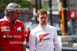 (L to R): Maurizio Arrivabene (ITA) Ferrari Team Principal with Sebastian Vettel (GER) Ferrari. 26.05.2016. Formula 1 World Championship, Rd 6, Monaco Grand Prix, Monte Carlo, Monaco, Practice Day.
