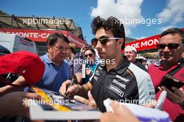 Sergio Perez (MEX) Sahara Force India F1 signs autographs for the fans. 25.05.2016. Formula 1 World Championship, Rd 6, Monaco Grand Prix, Monte Carlo, Monaco, Preparation Day.