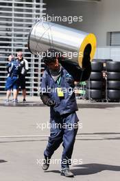 A man carrying a cylinder in the paddock. 28.10.2016. Formula 1 World Championship, Rd 19, Mexican Grand Prix, Mexico City, Mexico, Practice Day.