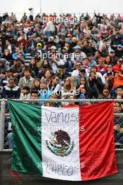 Fans in the grandstand and a Mexican flag. 28.10.2016. Formula 1 World Championship, Rd 19, Mexican Grand Prix, Mexico City, Mexico, Practice Day.
