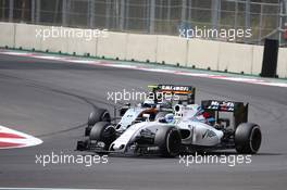Felipe Massa (BRA) Williams Martini Racing FW38 leads Sergio Perez (MEX) Force India F1 VJM09. 30.10.2016. Formula 1 World Championship, Rd 19, Mexican Grand Prix, Mexico City, Mexico, Race Day.