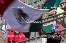 A masked fan with a Mexican flag. 29.10.2016. Formula 1 World Championship, Rd 19, Mexican Grand Prix, Mexico City, Mexico, Qualifying Day.