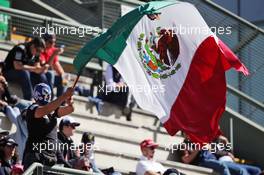 Fans in the grandstand and a masked fan with the Mexican flag. 29.10.2016. Formula 1 World Championship, Rd 19, Mexican Grand Prix, Mexico City, Mexico, Qualifying Day.