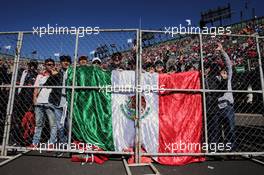 Fans in the grandstand and a Mexican flag. 29.10.2016. Formula 1 World Championship, Rd 19, Mexican Grand Prix, Mexico City, Mexico, Qualifying Day.