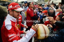 Sebastian Vettel (GER) Ferrari signs autographs for the fans. 27.10.2016. Formula 1 World Championship, Rd 19, Mexican Grand Prix, Mexico City, Mexico, Preparation Day.