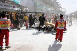 The Renault Sport F1 Team RS16 of Kevin Magnussen (DEN) is tended to by marshals and mechanics after it caught fire in the pits in the first practice session. 30.09.2016. Formula 1 World Championship, Rd 16, Malaysian Grand Prix, Sepang, Malaysia, Friday.