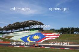 Max Verstappen (NLD) Red Bull Racing RB12 and Esteban Ocon (FRA) Manor Racing MRT05. 30.09.2016. Formula 1 World Championship, Rd 16, Malaysian Grand Prix, Sepang, Malaysia, Friday.