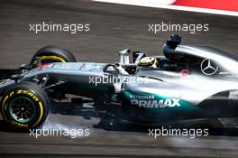 Lewis Hamilton (GBR) Mercedes AMG F1 W07 Hybrid locks up under braking. 30.09.2016. Formula 1 World Championship, Rd 16, Malaysian Grand Prix, Sepang, Malaysia, Friday.