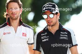(L to R): Romain Grosjean (FRA) Haas F1 Team with Sergio Perez (MEX) Sahara Force India F1. 30.09.2016. Formula 1 World Championship, Rd 16, Malaysian Grand Prix, Sepang, Malaysia, Friday.