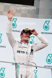 Nico Rosberg (GER) Mercedes AMG F1 celebrates his third position on the podium. 02.10.2016. Formula 1 World Championship, Rd 16, Malaysian Grand Prix, Sepang, Malaysia, Sunday.