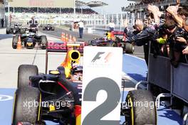 Second placed Max Verstappen (NLD) Red Bull Racing in parc ferme as race winner and team mate Daniel Ricciardo (AUS) Red Bull Racing RB12 arrives. 02.10.2016. Formula 1 World Championship, Rd 16, Malaysian Grand Prix, Sepang, Malaysia, Sunday.