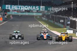 (L to R): Nico Rosberg (GER) Mercedes AMG F1 W07 Hybrid, Pascal Wehrlein (GER) Manor Racing MRT05, and Jolyon Palmer (GBR) Renault Sport F1 Team RS16, battle for position. 02.10.2016. Formula 1 World Championship, Rd 16, Malaysian Grand Prix, Sepang, Malaysia, Sunday.