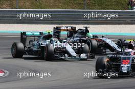 Nico Rosberg (GER) Mercedes AMG F1 W07 Hybrid and Nico Hulkenberg (GER) Sahara Force India F1 VJM09 battle for position. 02.10.2016. Formula 1 World Championship, Rd 16, Malaysian Grand Prix, Sepang, Malaysia, Sunday.