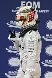 Lewis Hamilton (GBR) Mercedes AMG F1 celebrates his pole position in parc ferme. 01.10.2016. Formula 1 World Championship, Rd 16, Malaysian Grand Prix, Sepang, Malaysia, Saturday.