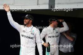 Lewis Hamilton (GBR) Mercedes AMG F1 celebrates his pole position in parc ferme. 01.10.2016. Formula 1 World Championship, Rd 16, Malaysian Grand Prix, Sepang, Malaysia, Saturday.