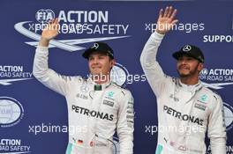 (L to R): Second placed Nico Rosberg (GER) Mercedes AMG F1 celebrates with team mate Lewis Hamilton (GBR) Mercedes AMG F1, who took pole position. 01.10.2016. Formula 1 World Championship, Rd 16, Malaysian Grand Prix, Sepang, Malaysia, Saturday.
