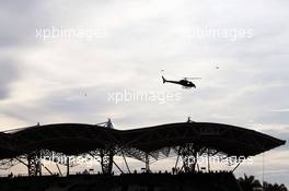 A helicopter flies over a grandstand. 01.10.2016. Formula 1 World Championship, Rd 16, Malaysian Grand Prix, Sepang, Malaysia, Saturday.