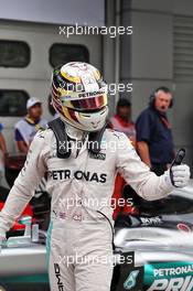 Lewis Hamilton (GBR) Mercedes AMG F1 celebrates his pole position in parc ferme. 01.10.2016. Formula 1 World Championship, Rd 16, Malaysian Grand Prix, Sepang, Malaysia, Saturday.