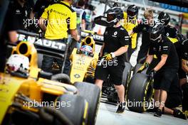 Jolyon Palmer (GBR) Renault Sport F1 Team RS16 and Kevin Magnussen (DEN) Renault Sport F1 Team RS16 in the pits. 01.10.2016. Formula 1 World Championship, Rd 16, Malaysian Grand Prix, Sepang, Malaysia, Saturday.