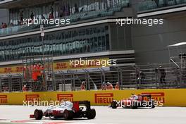Esteban Gutierrez (MEX) Haas F1 Team VF-16 passes Sebastian Vettel (GER) Ferrari SF16-H, who stopped on the start / finish straight in the second practice session. 29.10.2016. Formula 1 World Championship, Rd 4, Russian Grand Prix, Sochi Autodrom, Sochi, Russia, Practice Day.