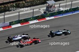 Nico Rosberg (GER) Mercedes AMG F1 W07 Hybrid leads Kimi Raikkonen (FIN) Ferrari SF16-H and Valtteri Bottas (FIN) Williams FW38 at the start of the race. 01.05.2016. Formula 1 World Championship, Rd 4, Russian Grand Prix, Sochi Autodrom, Sochi, Russia, Race Day.