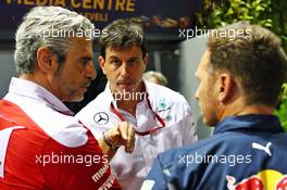 (L to R): Maurizio Arrivabene (ITA) Ferrari Team Principal with Toto Wolff (GER) Mercedes AMG F1 Shareholder and Executive Director with Christian Horner (GBR) Red Bull Racing Team Principal. 16.09.2016. Formula 1 World Championship, Rd 15, Singapore Grand Prix, Marina Bay Street Circuit, Singapore, Practice Day.