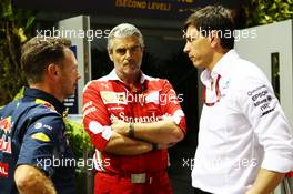 (L to R): Christian Horner (GBR) Red Bull Racing Team Principal with Maurizio Arrivabene (ITA) Ferrari Team Principal and Toto Wolff (GER) Mercedes AMG F1 Shareholder and Executive Director. 16.09.2016. Formula 1 World Championship, Rd 15, Singapore Grand Prix, Marina Bay Street Circuit, Singapore, Practice Day.