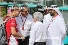 (L to R): Sebastian Vettel (GER) Ferrari with Pasquale Lattuneddu (ITA) of the FOM and Bernie Ecclestone (GBR). 25.11.2016. Formula 1 World Championship, Rd 21, Abu Dhabi Grand Prix, Yas Marina Circuit, Abu Dhabi, Practice Day.