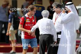 Sebastian Vettel (GER) Scuderia Ferrari and Bernie Eccelstone (GBR), FOM  25.11.2016. Formula 1 World Championship, Rd 21, Abu Dhabi Grand Prix, Yas Marina Circuit, Abu Dhabi, Practice Day.