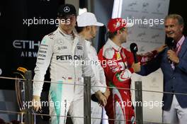 Nico Rosberg (GER) Mercedes AMG F1 celebrates his World Championship on the podium. 27.11.2016. Formula 1 World Championship, Rd 21, Abu Dhabi Grand Prix, Yas Marina Circuit, Abu Dhabi, Race Day.