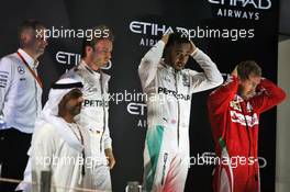 The podium (L to R): Nico Rosberg (GER) Mercedes AMG F1, second and World Champion; Lewis Hamilton (GBR) Mercedes AMG F1, race winner; Sebastian Vettel (GER) Ferrari, third. 27.11.2016. Formula 1 World Championship, Rd 21, Abu Dhabi Grand Prix, Yas Marina Circuit, Abu Dhabi, Race Day.