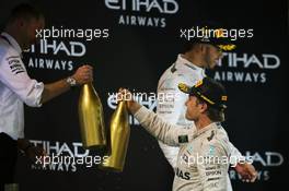 Second placed Nico Rosberg (GER) Mercedes AMG F1 celebrates his World Championship on the podium with Tony Ross (GBR) Mercedes AMG F1 Race Engineer. 27.11.2016. Formula 1 World Championship, Rd 21, Abu Dhabi Grand Prix, Yas Marina Circuit, Abu Dhabi, Race Day.