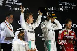 The podium (L to R): Nico Rosberg (GER) Mercedes AMG F1, second and World Champion; Lewis Hamilton (GBR) Mercedes AMG F1, race winner; Sebastian Vettel (GER) Ferrari, third. 27.11.2016. Formula 1 World Championship, Rd 21, Abu Dhabi Grand Prix, Yas Marina Circuit, Abu Dhabi, Race Day.