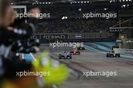 Race winner Lewis Hamilton (GBR) Mercedes AMG F1 W07 Hybrid crosses the finish line at the end of the race with second placed World Champion Nico Rosberg (GER) Mercedes AMG F1 W07 Hybrid. 27.11.2016. Formula 1 World Championship, Rd 21, Abu Dhabi Grand Prix, Yas Marina Circuit, Abu Dhabi, Race Day.