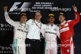 1st place Lewis Hamilton (GBR) Mercedes AMG F1 W07 , 2nd place and new world champion Nico Rosberg (GER) Mercedes AMG Petronas F1 W07 and 3rd place Sebastian Vettel (GER) Scuderia Ferrari SF16-H. 27.11.2016. Formula 1 World Championship, Rd 21, Abu Dhabi Grand Prix, Yas Marina Circuit, Abu Dhabi, Race Day.